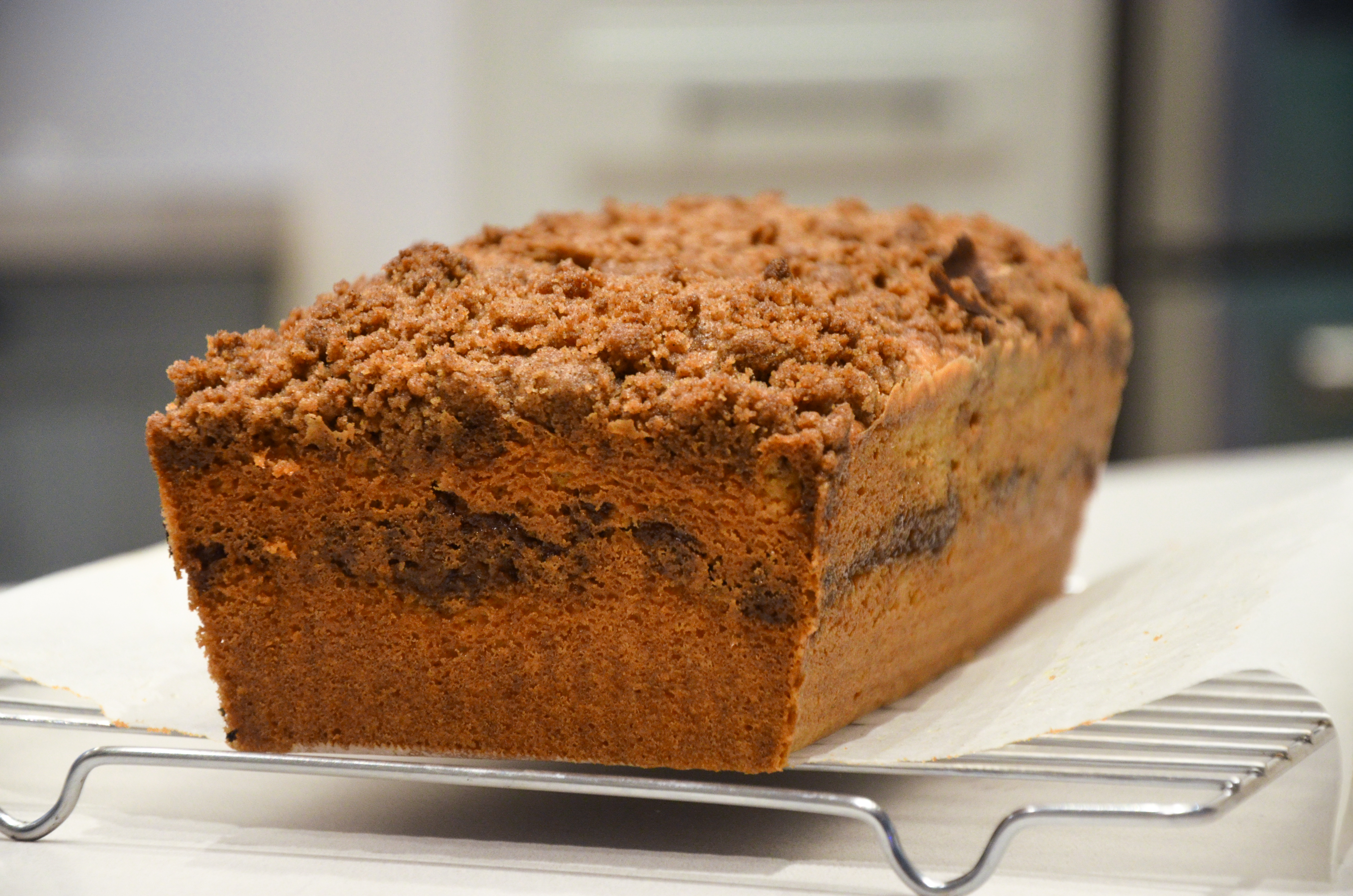 Sour Cream Coffee Cake on a wire cooling rack